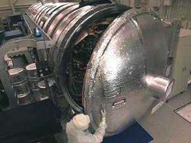 Vacuum_chamber-being_opened_by_engineer